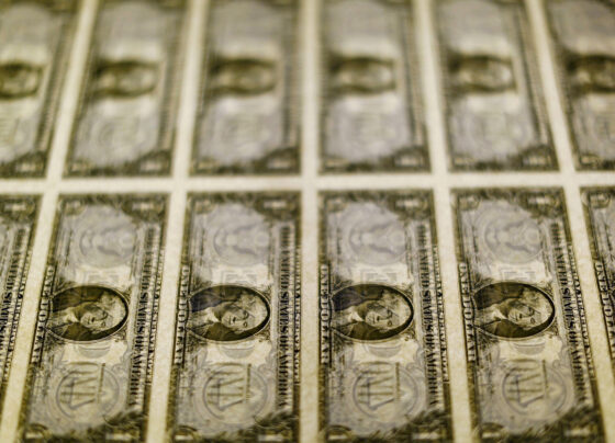 FILE PHOTO: United States one dollar bills are seen on a light table at the Bureau of Engraving and Printing in Washington in this November 14, 2014, file photo. REUTERS/Gary Cameron