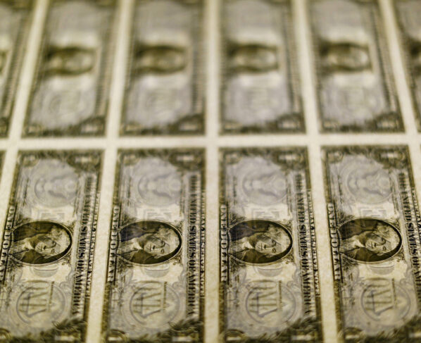 FILE PHOTO: United States one dollar bills are seen on a light table at the Bureau of Engraving and Printing in Washington in this November 14, 2014, file photo. REUTERS/Gary Cameron