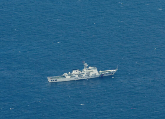 A Chinese Coast Guard vessel is pictured near the Philippine-occupied Thitu Island, in the disputed Spratly Islands, South China Sea. REUTERS/Eloisa Lopez