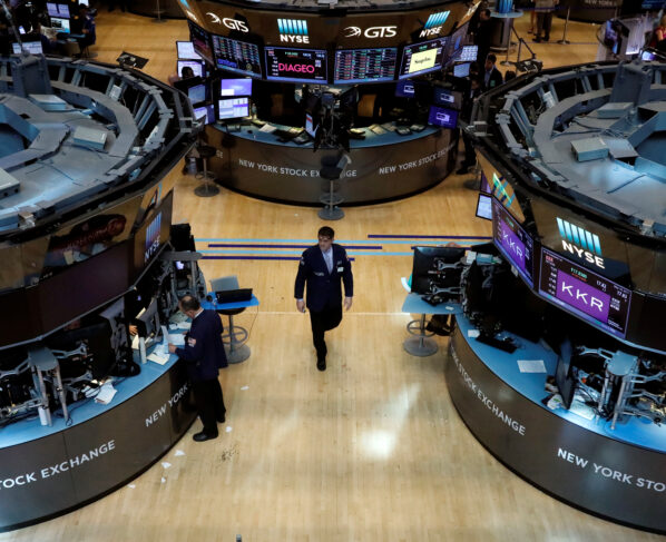 Traders work on the floor of the New York Stock Exchange (NYSE) in New York City, NY, U.S. REUTERS/Brendan McDermid