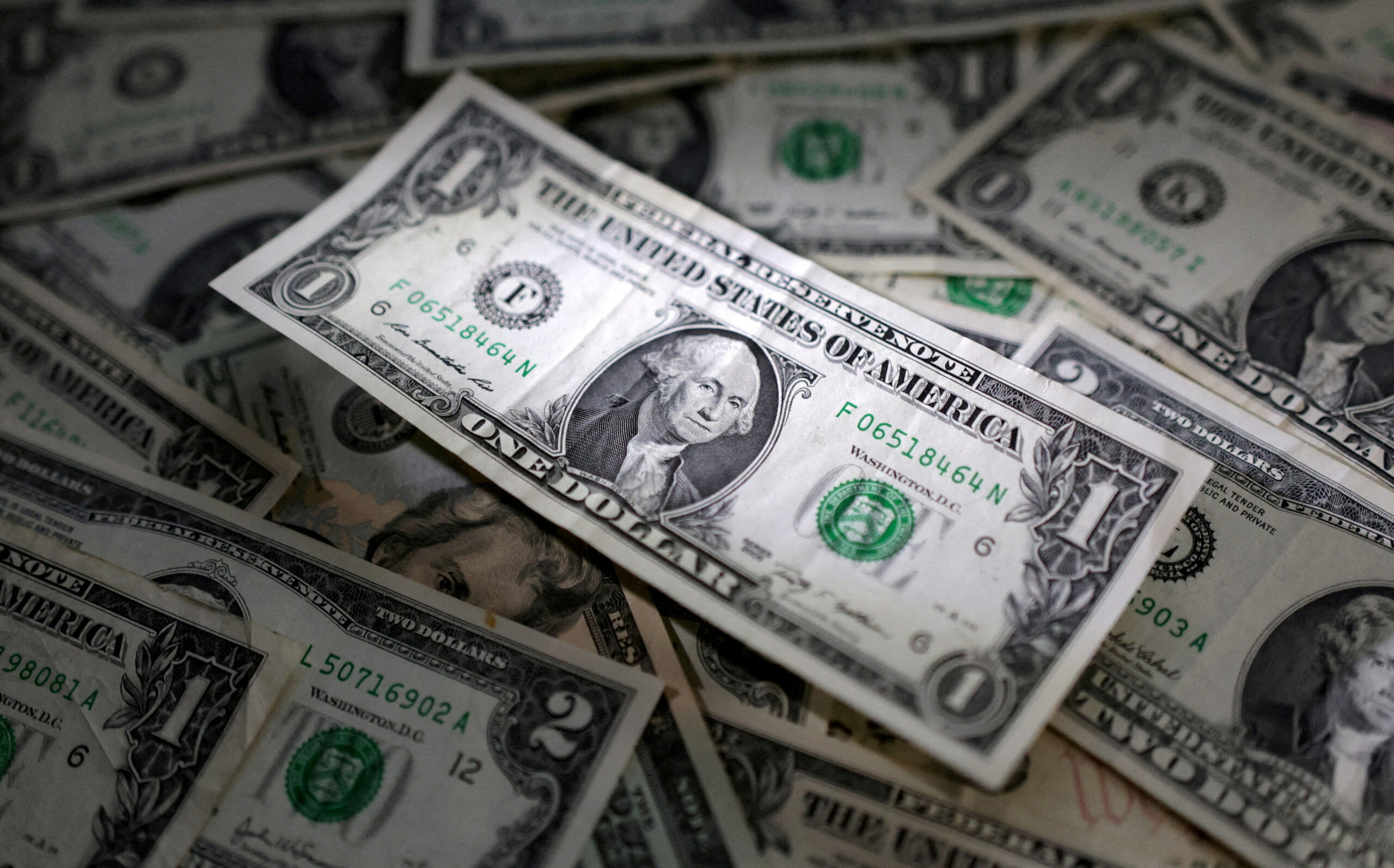 Dollar firm ahead of Powell testimony, sterling up on hot inflation